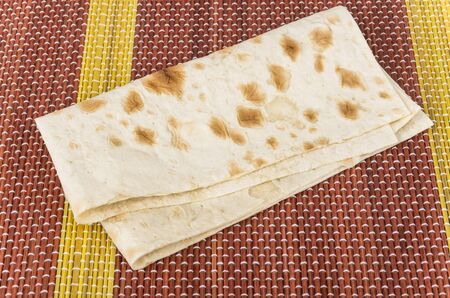 Folded of thin Armenian lavash on bamboo mat