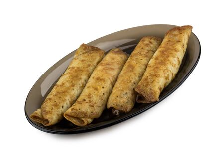 Pancake stuffed on black transparent dish isolated on white backgroundの写真素材