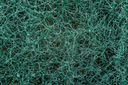 Rectangular abstract textured green background of interwoven threadsの写真素材