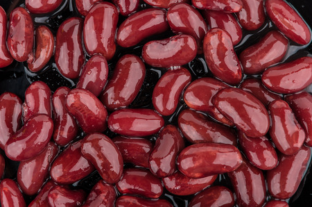 Background of red canned beans on black plateの写真素材