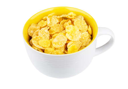 Glass bowl with cornflakes isolated on white backgroundの写真素材