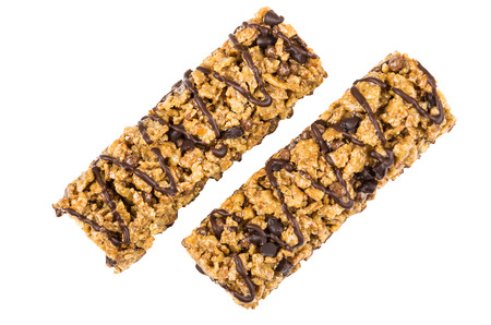 Two granola bars with cereals and chocolate isolated on white backgroundの写真素材