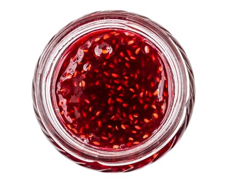 Open glass jar with raspberry jam isolated on white background. Top viewの写真素材