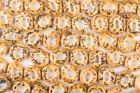 Many small bread rings with poppy seedsの写真素材