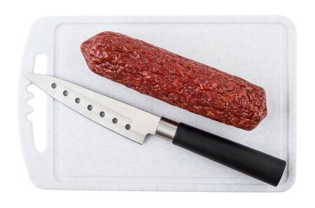 Smoked sausage and kitchen knife on cutting board isolated on white background. Top viewの写真素材
