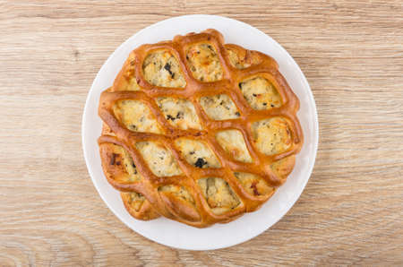 Pie filling in plate on wooden table. Top viewの写真素材