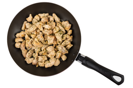 Prepared chicken meat in frying pan isolated on white background. Top viewの写真素材