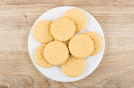 Cookies with stuffed in white plate on wooden table. Top viewの写真素材