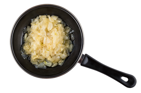Fried white onion in frying pan isolated on white background. Top viewの写真素材