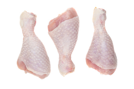 Three raw chicken legs isolated on white background. Top viewの写真素材
