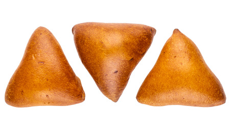 Three triangular pies with stuffing isolated on white background. Top viewの写真素材
