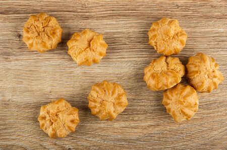 Few profiteroles on wooden table. Top view