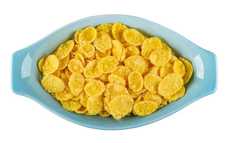 Corn flakes in blue oval bowl isolated on white background. Top view