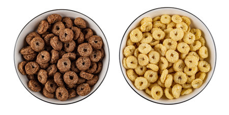 Glass bowls with toasted cereal breakfasts with chocolate and caramel isolated on white background. Top viewの写真素材