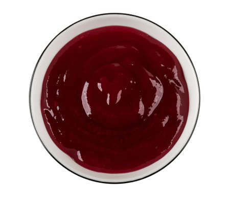 Cherry jam in glass bowl isolated on white background. Top viewの写真素材