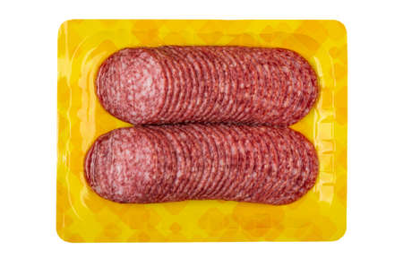 Slices of sausage salami in vacuum package isolated on white background. Top viewの写真素材