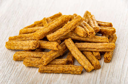 Small heap of salted croutons on wooden tableの写真素材