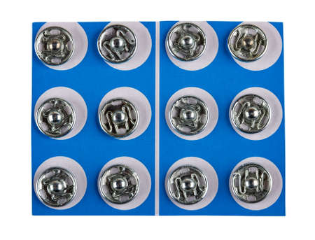 Metallic button kit isolated on white background. Top view