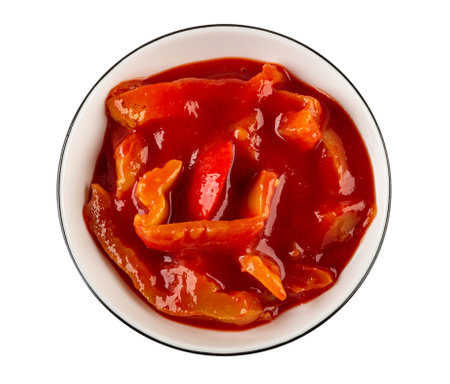 White glass bowl with lecho isolated on white background. Top viewの写真素材