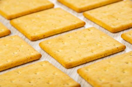 Tiled of many dry cookies on wooden table