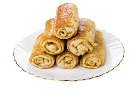 Heap of pancake rolls  with stuffed in glass plate isolated on white backgroundの写真素材