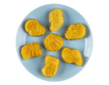 Fried chicken nuggets in glass blue plate isolated on white background. Top view