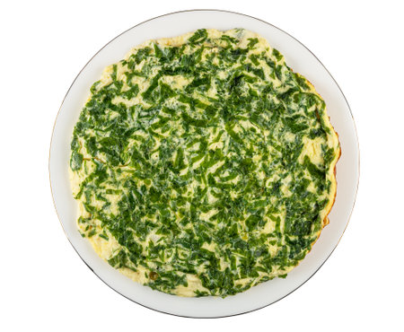 Omelet with chopped parsley in white glass plate isolated on white background. Top viewの写真素材