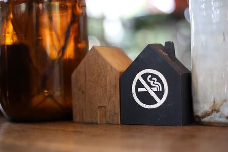 House shape signs made of wood, with no smoking symbolsの写真素材