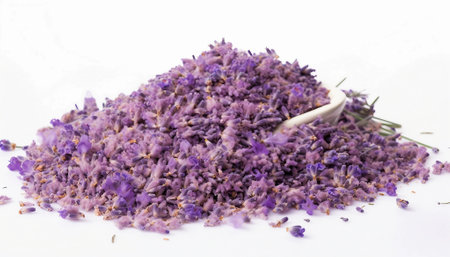 Dried lavender flowers in a bowl isolated on white background.の素材