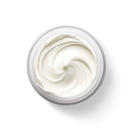 Cosmetic cream in a circular jar isolated on white background. Top view. blank cosmetic products, packagingの素材