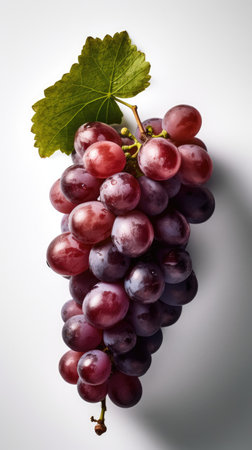 Ripe red grapes on a white background, close-up.の素材