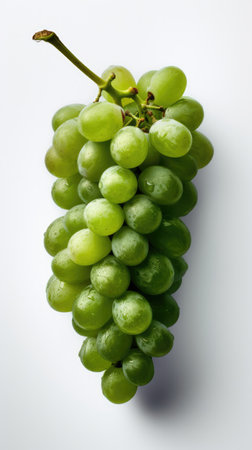 Bunch of fresh green grapes on a white background, top view, clean shotの素材