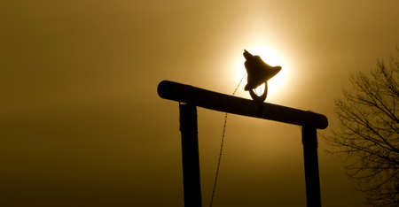 Bell with sunset behind の写真素材
