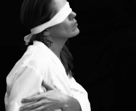 blindfolded woman as lady justiceの写真素材