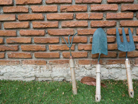 Garden tools over masonry wallsの写真素材