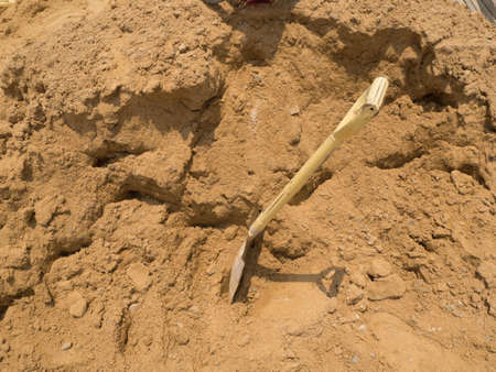 Tool shovel and sand for construction