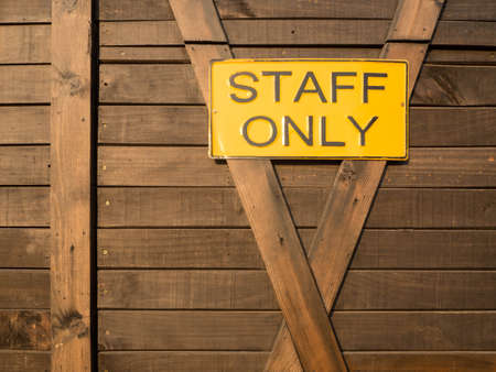 Staff only on real wooden backgroundの写真素材