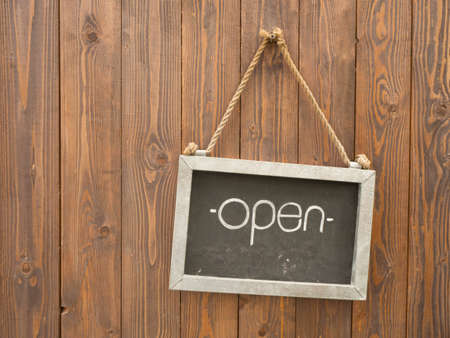Open sign on real wood backgroundの写真素材