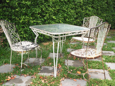 Vintage set of table and chairs for outdoors in the gardenの写真素材