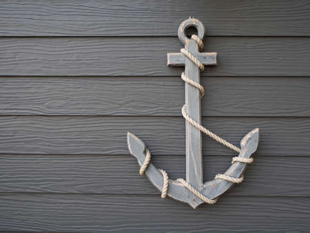 Antique anchor on vintage wooden grey backgroundの写真素材