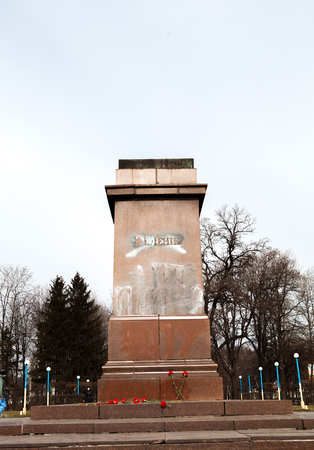 DNIPRODZERZHYNSK, UKRAINE  23 FEBRUARY 2014: Demonstrators destroyed the monument of Vladimir Lenin in the centre of Dniprodzerzhynsk during Ukrainian revolution on February 23,2014 in DNIPRODZERZHYNSK, UKRAINEのeditorial素材