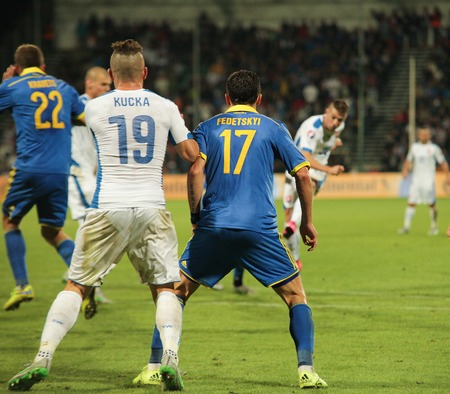 Zilina, Slovakia -  SEPTEMBER 8: Artem Fedetskyi and Juraj Kucka national soccer team player  during a UEFA EURO 2016   Slovakia - Ukraine match on September 8, 2015 in Zilina, Slovakia.のeditorial素材