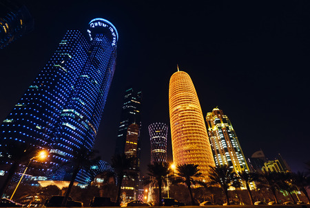 Doha city, Qatar - January 02, 2018: Night scene of the Al Dafna district of the Qatari capital Doha located on the Persian Gulf., Doha, Qatar.のeditorial素材
