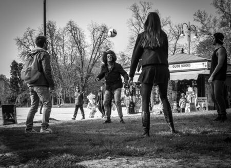 Milan, Italy - March 23, 2016: Teenagers students play football in Sempione Park  (Parco Sempione)  in Milan, Italyのeditorial素材