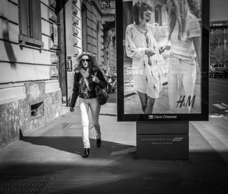 Milan, Italy - March 23, 2016:  Fashion dressed female walks by the italian street in Milan, Italyのeditorial素材