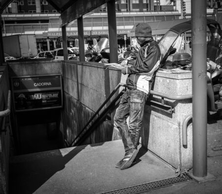 Milan, Italy - March 23, 2016:  Black man waiting somebody near the Subway in Milan, Italyのeditorial素材