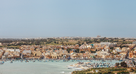 Aerial view of the Marsaxlokk - traditional fishing village in the South Eastern Region of Malta main island. の写真素材