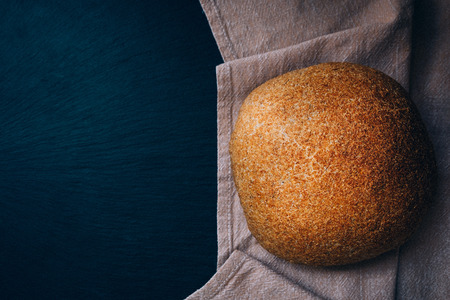 Top view of the just homebaked bread on the cool stone table.の写真素材