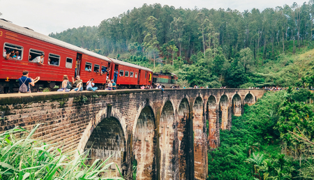 Demodara, Sri Lanka - December 30, 2017: Train arrival moment on famous Nine Arch Bridge or the Bridge in the Sky - is a bridge in Demodara, Sri Lanka.のeditorial素材