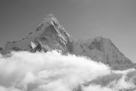 Ama Dablam 6814m clouds covered peak View near Dingboche settlement in Sagarmatha National Park, Nepal. Everest Base Camp (EBC) trekking route.の写真素材
